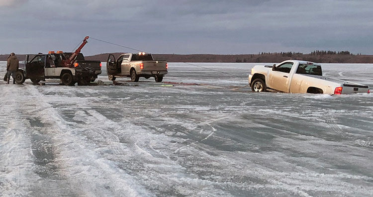 Trucks fall through ice