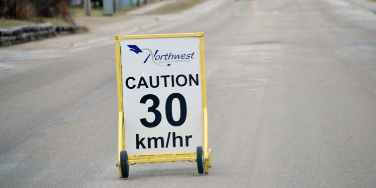 Driver smashes school speed zone sign