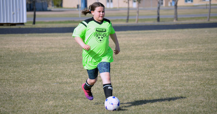 Players receive their own soccer balls