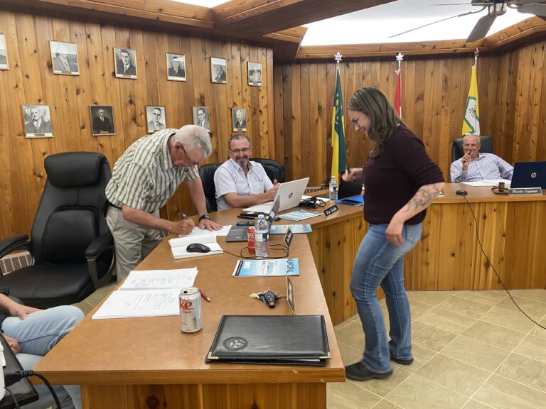 Harrison rejoins council by taking oath of office